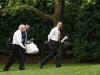 President Barack Obama and Vice President Joe Biden return to the White House with takeout after lunch at Ray's Hell Burger across the Potomac in Arlington, Virginia.