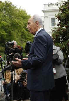 After meeting with President Obama, Israeli President Peres talks to reporters assembled outside the West Wing of the White House.