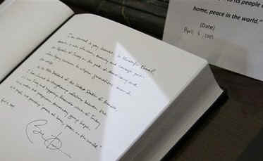 President Barack Obama signs the Memorial Book in the Anitkabir Mausoleum in Ankara, Turkey on April 6, 2009.