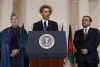President Barack Obama speaks to the media in the Grand Foyer of the White House after trilateral meetings.