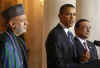 President Barack Obama speaks to the media in the Grand Foyer of the White House after trilateral meetings.
