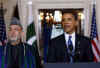 President Barack Obama speaks to the media in the Grand Foyer of the White House after trilateral meetings.