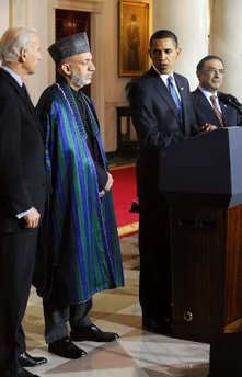 President Barack Obama speaks to the media in the Grand Foyer of the White House after trilateral meetings.