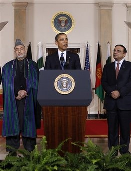 President Barack Obama speaks to the media in the Grand Foyer of the White House after trilateral meetings.