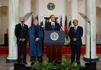 President Barack Obama speaks to the media in the Grand Foyer of the White House after trilateral meetings.