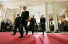 President Barack Obama leaves the Grand Foyer of the White House with Afghanistan's President Hamid Karzai and Pakistan's President Asif Ali Zardari on May 6, 2009.