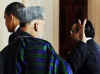 President Barack Obama leaves the Grand Foyer of the White House with Afghanistan's President Hamid Karzai and Pakistan's President Asif Ali Zardari on May 6, 2009.