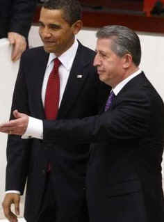 President Obama was led into the Turkish Parliament by Speaker Koksal Toptan. 