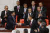President Obama was led into the Turkish Parliament by Speaker Koksal Toptan. 
