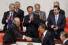 President Obama was led into the Turkish Parliament by Speaker Koksal Toptan. 