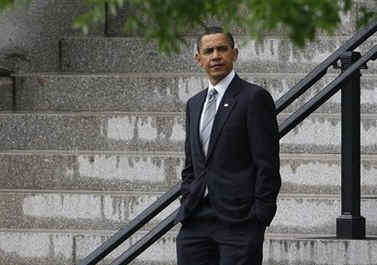 President Barack Obama leaves the Eisenhower Executive Building after delivering remarks on reducing spending in the budget with Budget Director Peter Orzag and Deputy Budget Director Robert Nabors.