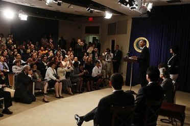 President Barack Obama makes an unannounced visit to a Spanish language Town Hall meeting in the Eisenhower Executive Office Building on May 8, 2009.