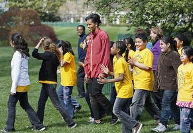 First Lady Michelle Obama after tending to her White House Kitchen Garden with help from students of Bancroft Elementary School.