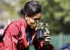 First Lady Michelle Obama Obama tends to her White House Kitchen Garden with help from students of Bancroft Elementary School.