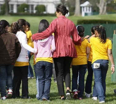 First Lady Michelle Obama after tending to her White House Kitchen Garden with help from students of Bancroft Elementary School.