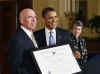 President Obama presents the Outstanding American By Choice award to Peter Lemon.