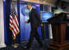 President Barack Obama interrupts the press briefing by Press Secretary Robert Gibbs in the Brady Press Briefing Room.