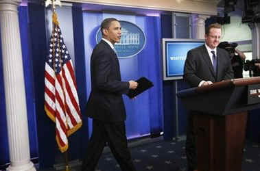 President Barack Obama interrupts the press briefing by Press Secretary Robert Gibbs in the Brady Press Briefing Room.