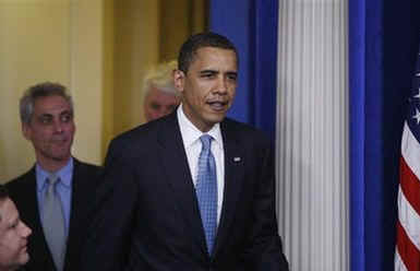 President Barack Obama interrupts the press briefing by Press Secretary Robert Gibbs in the Brady Press Briefing Room.