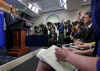 President Barack Obama interrupts the press briefing by Press Secretary Robert Gibbs in the Brady Press Briefing Room.