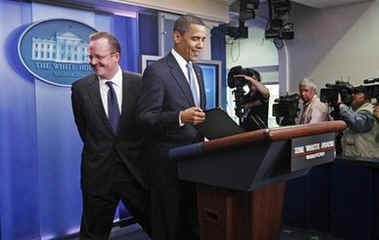 President Barack Obama interrupts the press briefing by Press Secretary Robert Gibbs in the Brady Press Briefing Room.