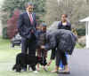 First Lady Michelle Obama leads Bo the new First Dog from the White House to the South Lawn.