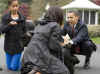 First Lady Michelle Obama leads Bo the new First Dog from the White House to the South Lawn.