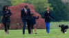 Malia Obama walks with Bo on the South Lawn of the White House on Bo's first day in his new home.