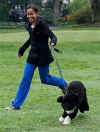 Malia Obama runs with Bo on the South Lawn of the White House on Bo's first day in his new home.