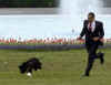 President Obama runs with Bo on the South Lawn of the White House on Bo's first day in his new home.