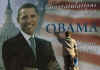 A worker in Pristina, Kosovo hangs a billboard congratulating Barack Obama on January 20, 2009. 
