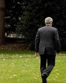 President George W. Bush walks away on the South Lawn of the White House after conference congratulating President-elect Barack Obama on November 6, 2008.