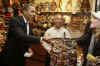 President Barack Obama's motorcade makes an unscheduled stop at an Ottawa market. President Obama purchases Ottawa key rings from a novelty store at market near the US Embassy in Ottawa.