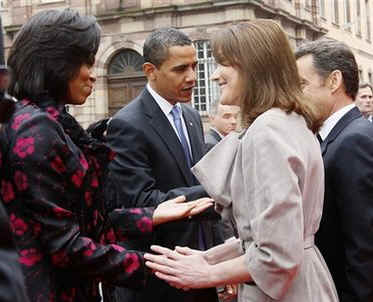 President Barack Obama and First Lady Michelle Obama are greeted by French President Sarkozy and his wife Carla Bruni-Sarkozy at the Palais Rohan in Strasbourg, France.